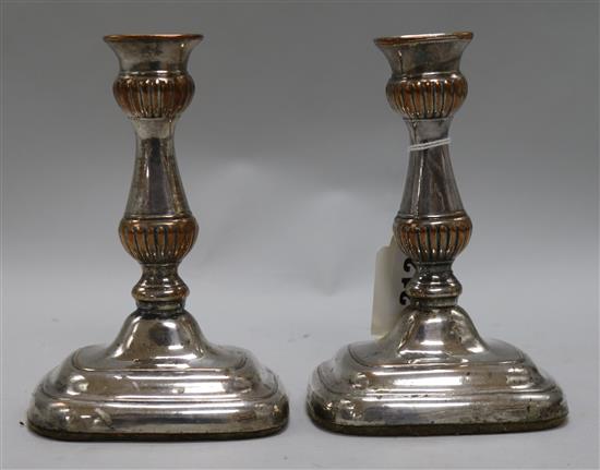 A pair of plated candlesticks
